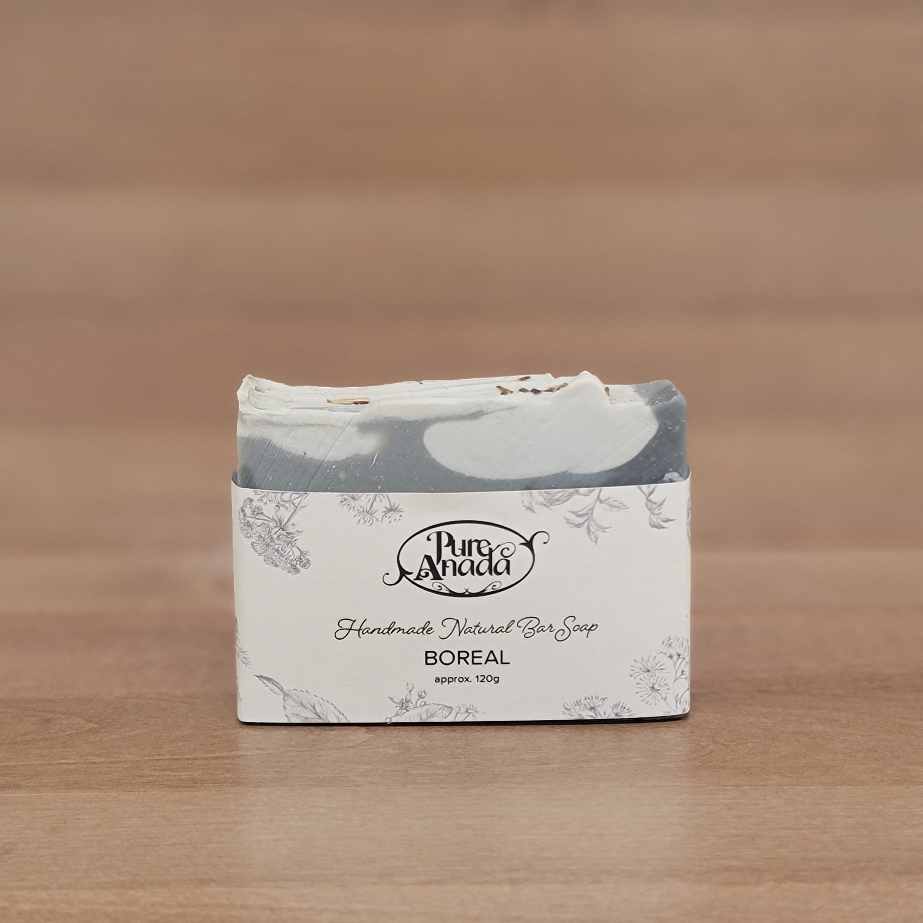 Product packaging with a brand logo on a wooden surface